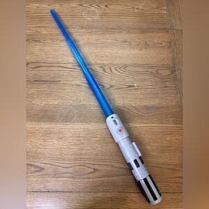 Blue and Silver Toy Lightsaber